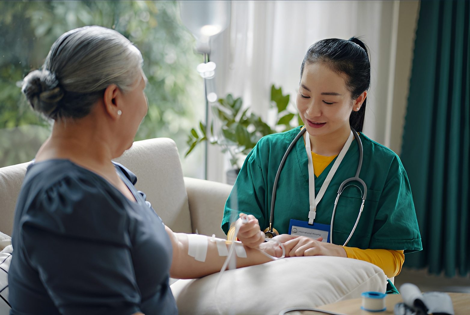 Nurse caring for elderly patient at home.